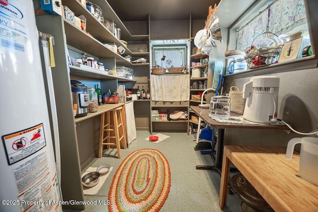 home office featuring water heater and tile patterned floors