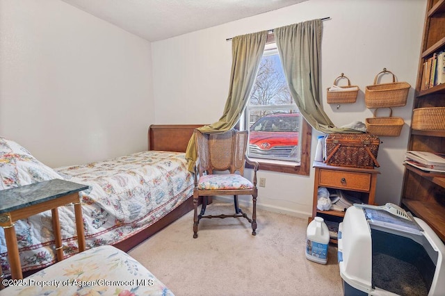 bedroom with carpet and baseboards