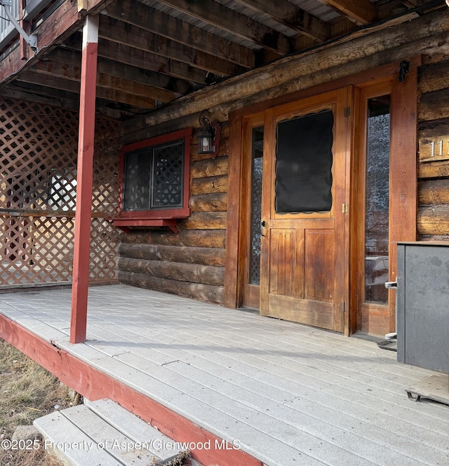 doorway to property with a deck