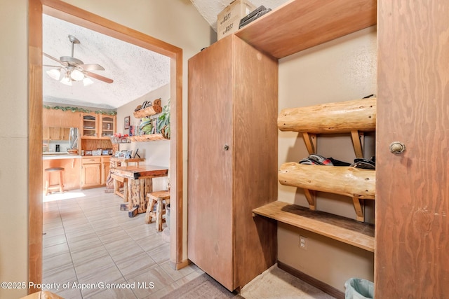 565 Sandrock Dr, Craig, CO 81625 - hall featuring a textured ceiling and light tile patterned floors