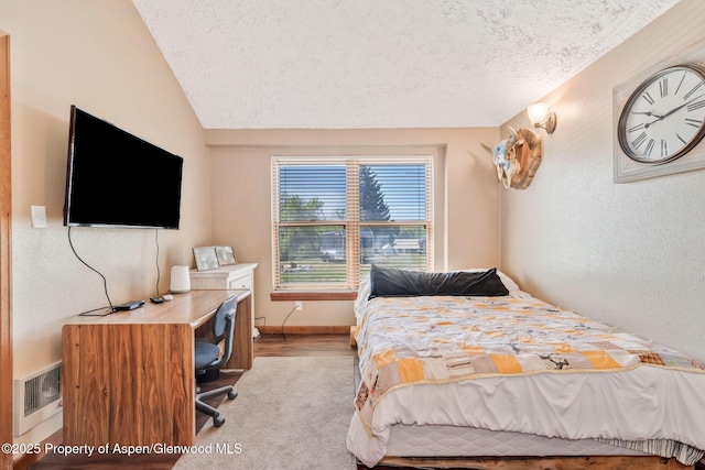 565 Sandrock Dr, Craig, CO 81625 - bedroom with a textured ceiling, lofted ceiling, and carpet floors