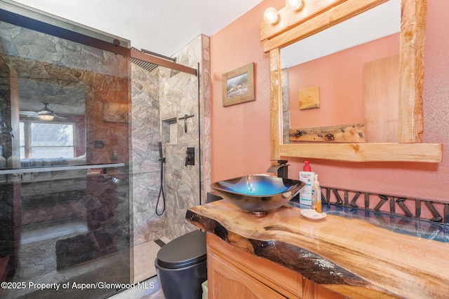 565 Sandrock Dr, Craig, CO 81625 - bathroom featuring a fireplace, a marble finish shower, vanity, and toilet