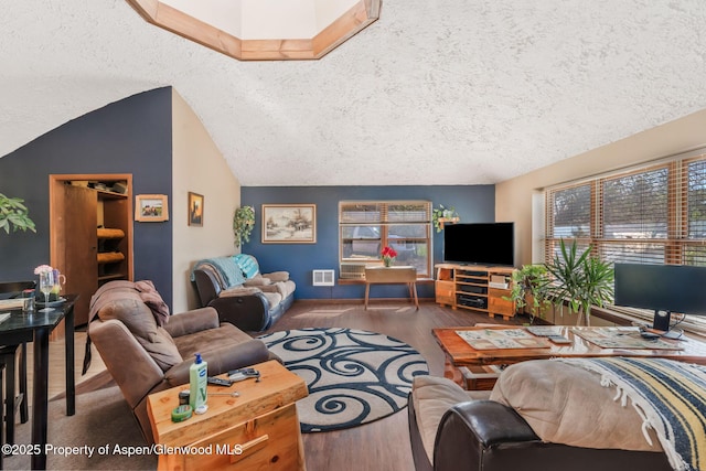 565 Sandrock Dr, Craig, CO 81625 - living room featuring wood finished floors, a textured ceiling, and lofted ceiling