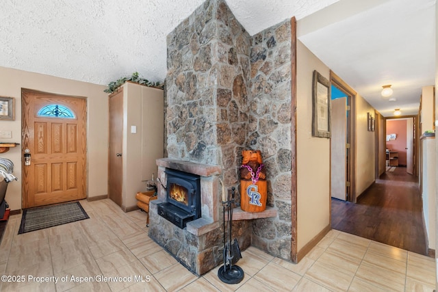 565 Sandrock Dr, Craig, CO 81625 - tiled entrance foyer featuring a textured ceiling and baseboards
