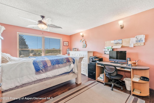 565 Sandrock Dr, Craig, CO 81625 - bedroom with wood finished floors, a desk, a textured ceiling, and a ceiling fan