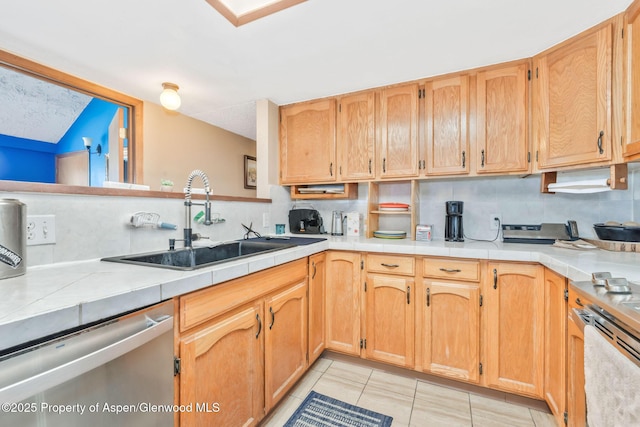 565 Sandrock Dr, Craig, CO 81625 - kitchen featuring appliances with stainless steel finishes, a sink, light tile patterned floors, and backsplash