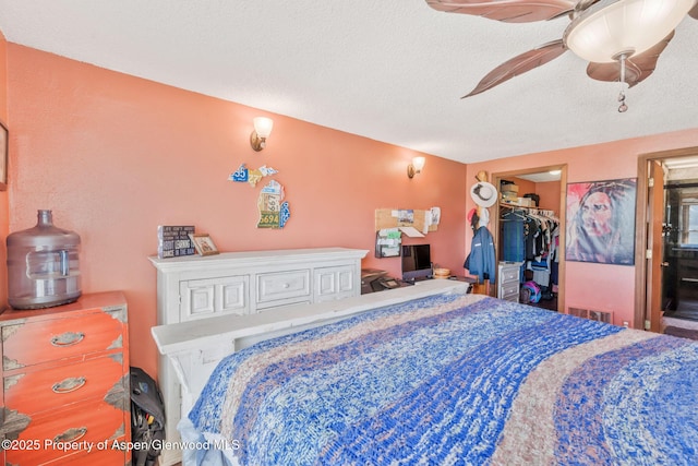 565 Sandrock Dr, Craig, CO 81625 - bedroom with a spacious closet, ceiling fan, a textured ceiling, and a closet