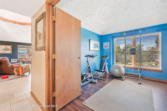 565 Sandrock Dr, Craig, CO 81625 - exercise area with a textured ceiling and baseboards