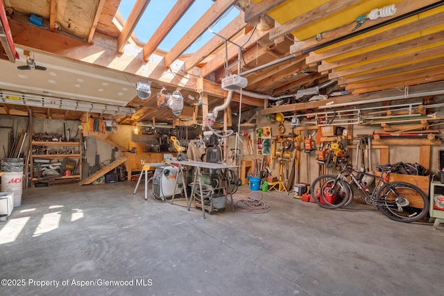 565 Sandrock Dr, Craig, CO 81625 - garage with a workshop area and a garage door opener