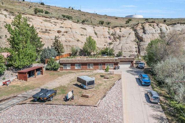 565 Sandrock Dr, Craig, CO 81625 - view of front of house with an outdoor structure, driveway, and a garage