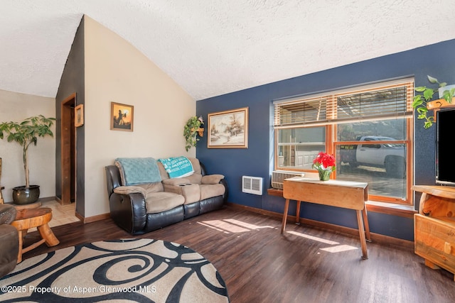 565 Sandrock Dr, Craig, CO 81625 - living room featuring vaulted ceiling, a textured ceiling, wood finished floors, and baseboards
