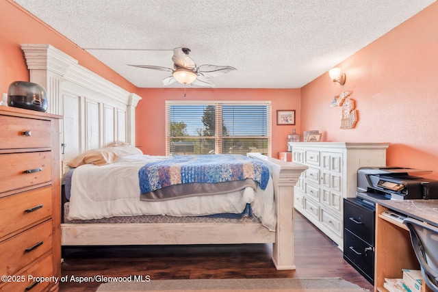 565 Sandrock Dr, Craig, CO 81625 - bedroom featuring dark wood-type flooring, a textured ceiling, and a ceiling fan