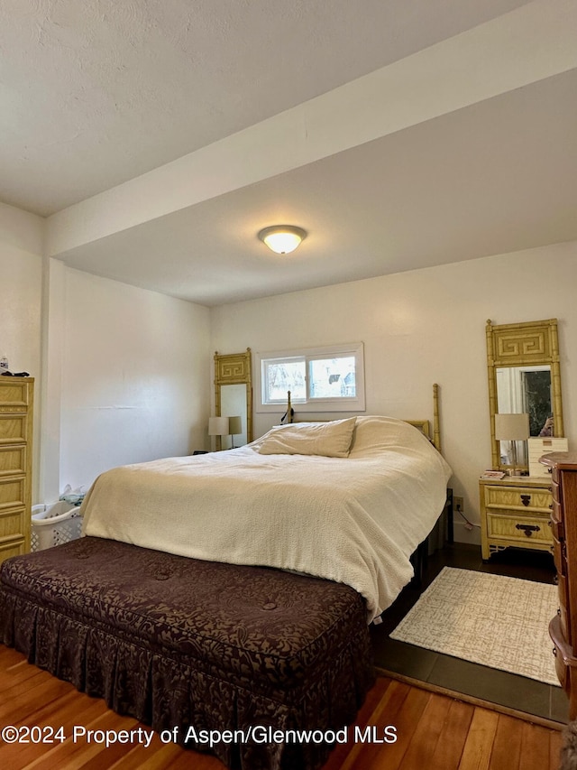 bedroom featuring hardwood / wood-style flooring