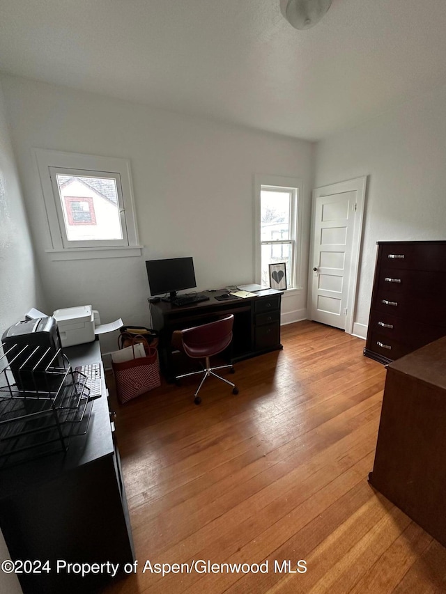 home office with light wood-type flooring