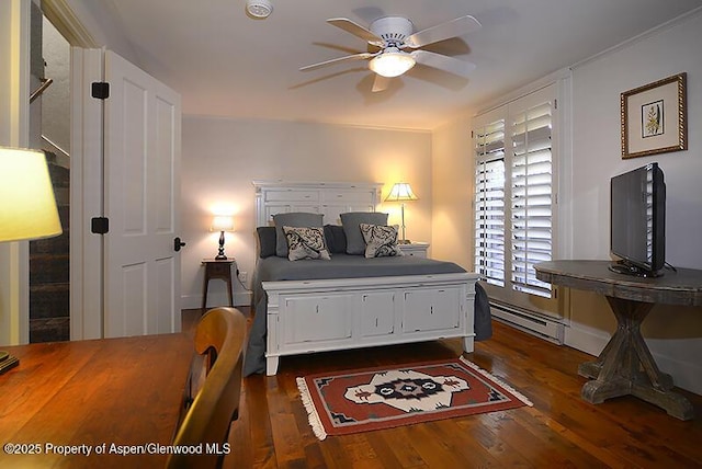 800 E Hopkins Ave Unit A-1, Aspen, CO 81611 - bedroom featuring dark wood finished floors and a baseboard heating unit