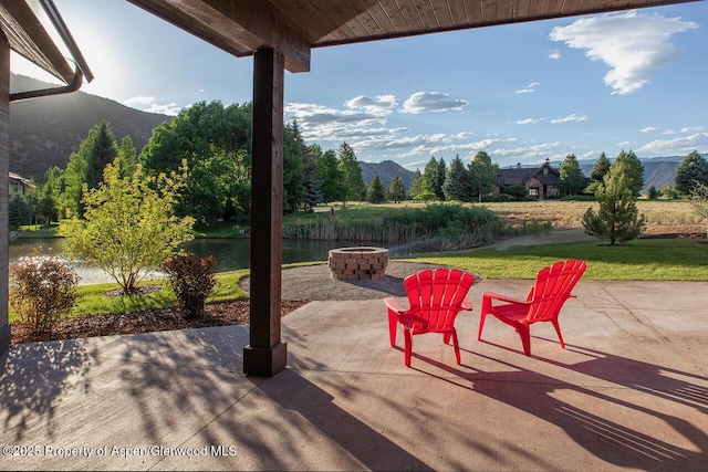 115 Sundance Trl, Carbondale, CO 81623 - view of patio / terrace featuring a fire pit and a water and mountain view