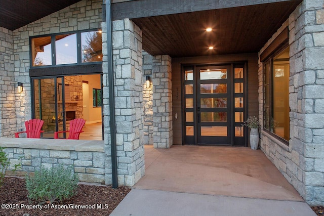 115 Sundance Trl, Carbondale, CO 81623 - property entrance featuring stone siding and a porch
