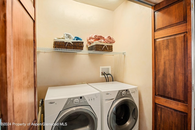 laundry room with separate washer and dryer