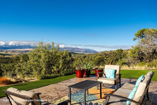 view of patio / terrace with outdoor lounge area and a mountain view