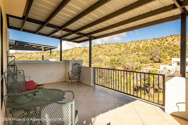 balcony featuring a mountain view