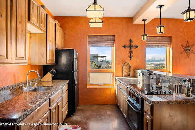 kitchen with decorative light fixtures, black appliances, and sink