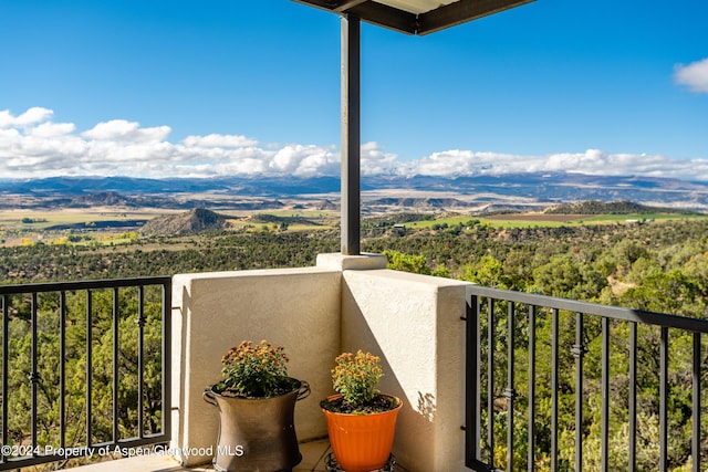 balcony featuring a mountain view