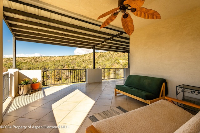 view of patio / terrace with ceiling fan, a balcony, and an outdoor hangout area