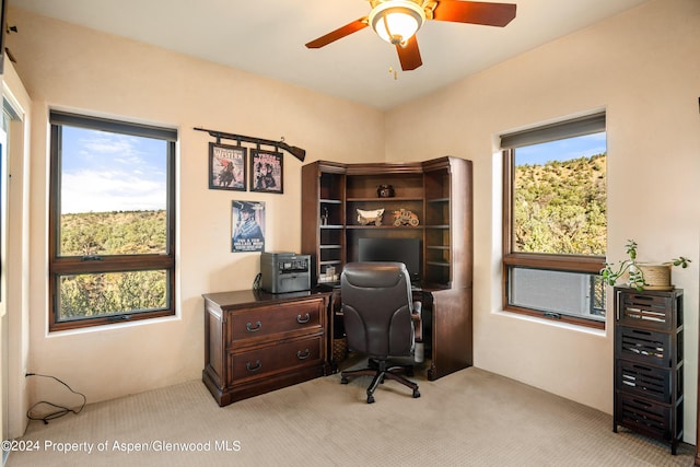 office space with ceiling fan and light colored carpet