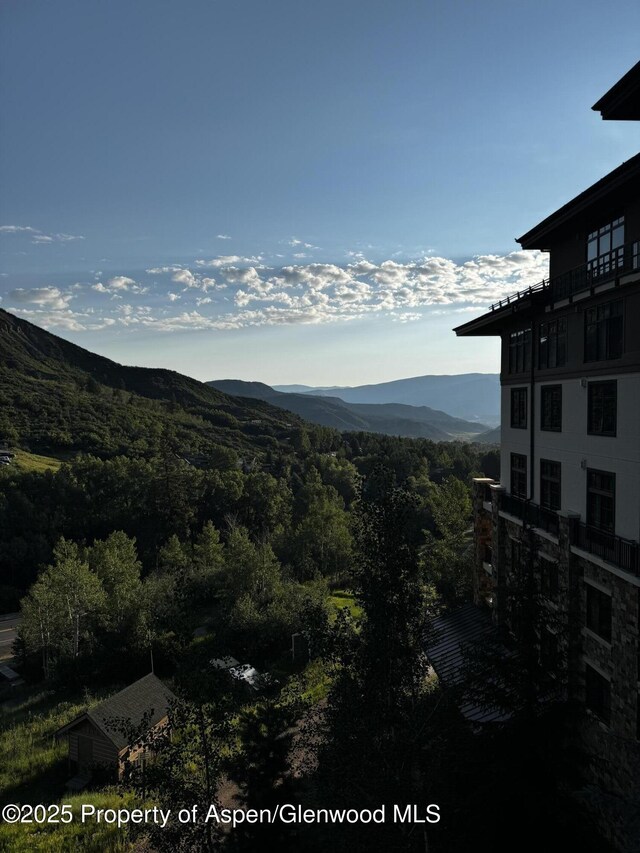 130 Wood Rd Unit 514, Snowmass Village, CO 81615 - property view of mountains featuring a forest view