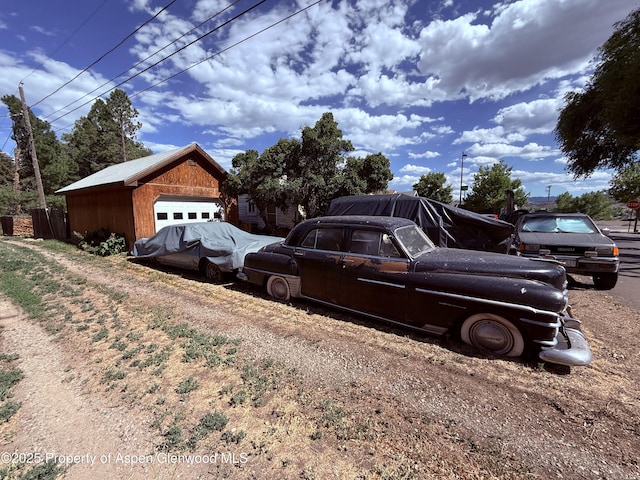 110 N 5th St, Silt, CO 81652 - view of property exterior with a garage and an outbuilding