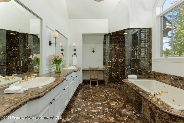 74 Pfister Dr Unit 101, Aspen, CO 81611 - bathroom featuring marble tiled floors, a shower stall, a whirlpool tub, and healthy amount of natural light