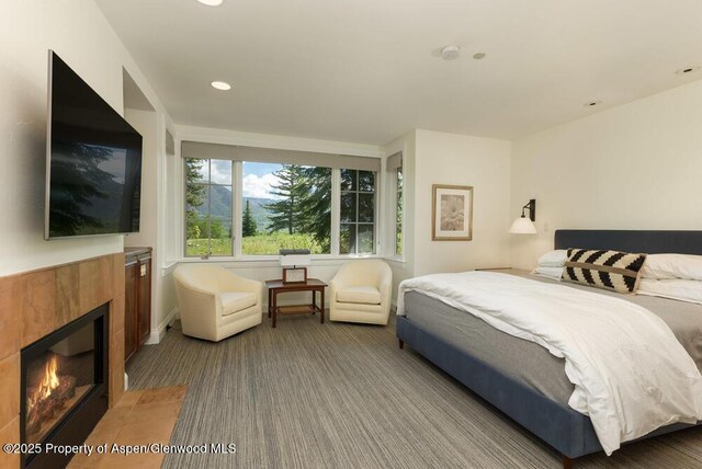 74 Pfister Dr Unit 101, Aspen, CO 81611 - bedroom featuring carpet floors, a tiled fireplace, and recessed lighting