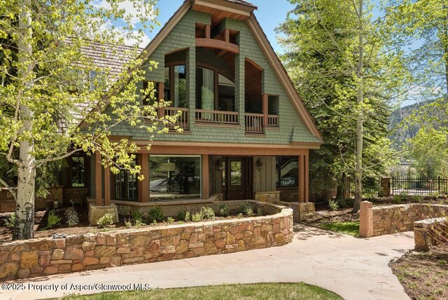 74 Pfister Dr Unit 101, Aspen, CO 81611 - view of front of home with a balcony and board and batten siding