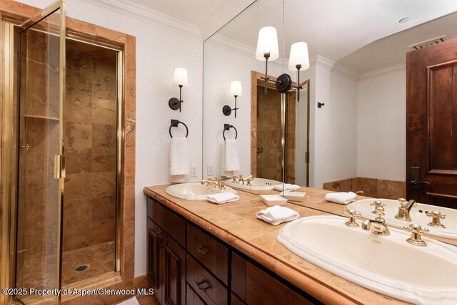 74 Pfister Dr Unit 101, Aspen, CO 81611 - bathroom featuring a stall shower, double vanity, and crown molding