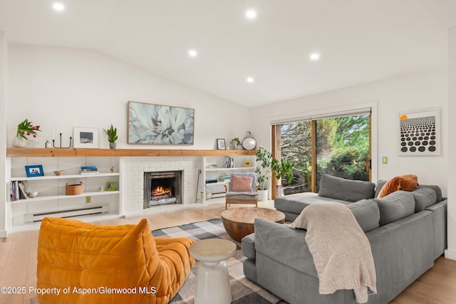 living area featuring baseboard heating, recessed lighting, and wood finished floors