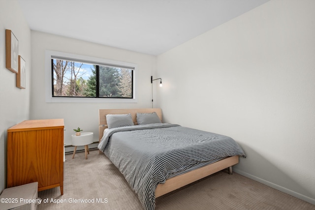 bedroom featuring light colored carpet, baseboards, and a baseboard radiator