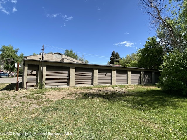 garage featuring a yard