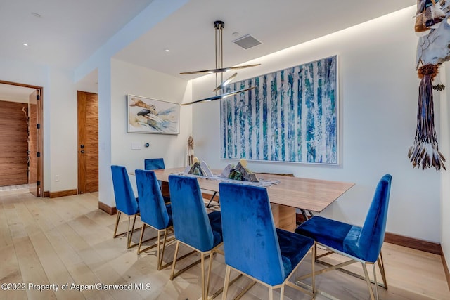 dining area featuring light wood-type flooring