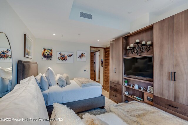 bedroom featuring wooden walls