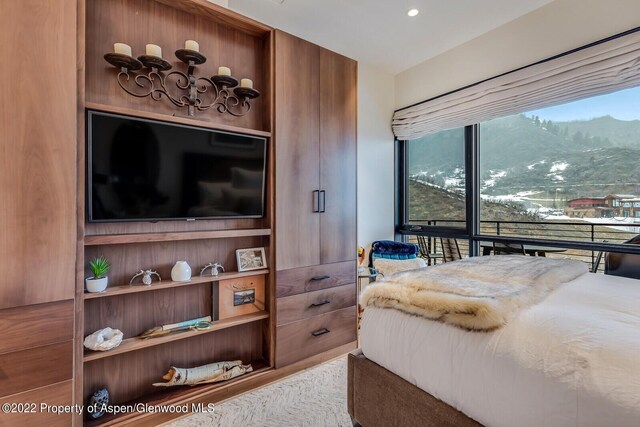 bedroom featuring a mountain view