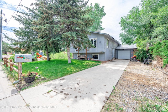 1617 W 7th St, Rifle, CO 81650 - tri-level home with driveway, an attached garage, and a front yard
