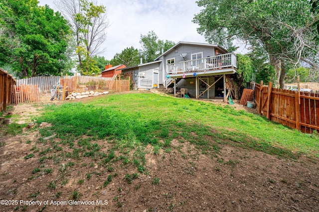 1617 W 7th St, Rifle, CO 81650 - rear view of house with a wooden deck, a fenced backyard, and stairs