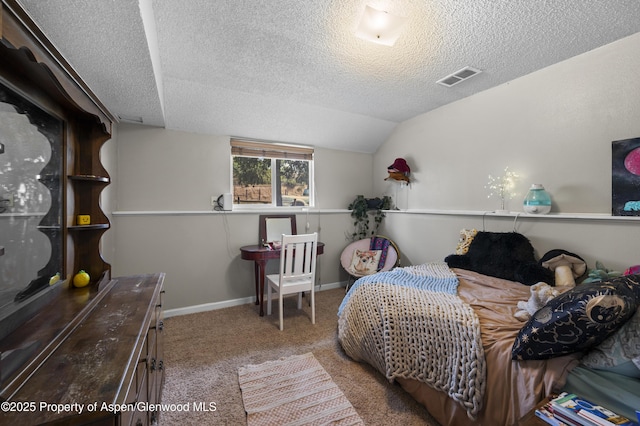 1617 W 7th St, Rifle, CO 81650 - carpeted bedroom with a textured ceiling and lofted ceiling