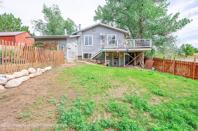 1617 W 7th St, Rifle, CO 81650 - back of property with stairs, a deck, and a fenced backyard