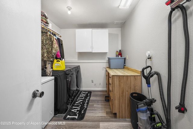 1617 W 7th St, Rifle, CO 81650 - laundry room with independent washer and dryer, cabinet space, and dark wood-type flooring