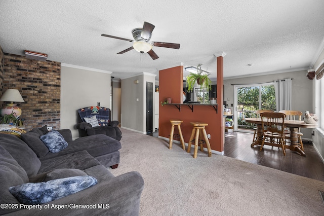 1617 W 7th St, Rifle, CO 81650 - living room with ceiling fan, carpet flooring, ornamental molding, and a textured ceiling