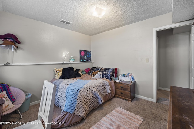 1617 W 7th St, Rifle, CO 81650 - carpeted bedroom with a textured ceiling and baseboards