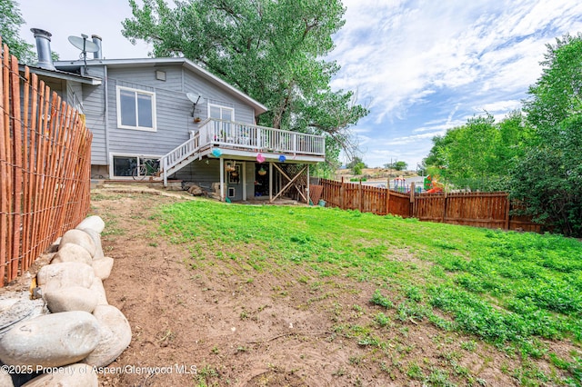 1617 W 7th St, Rifle, CO 81650 - back of property featuring stairs, a deck, and a fenced backyard