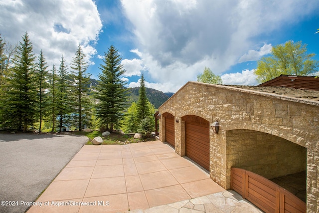 view of patio / terrace with a mountain view