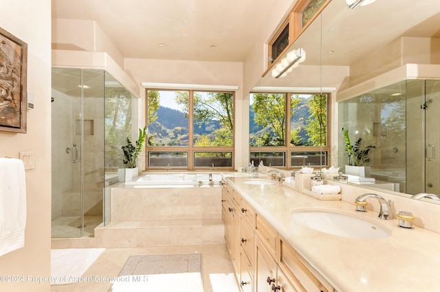 bathroom with independent shower and bath, vanity, and tile patterned floors